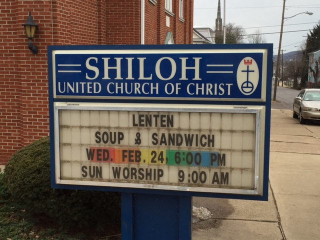 Shiloh United Church of Christ sign. The date and time of an event are highlighted with a rainbow background.